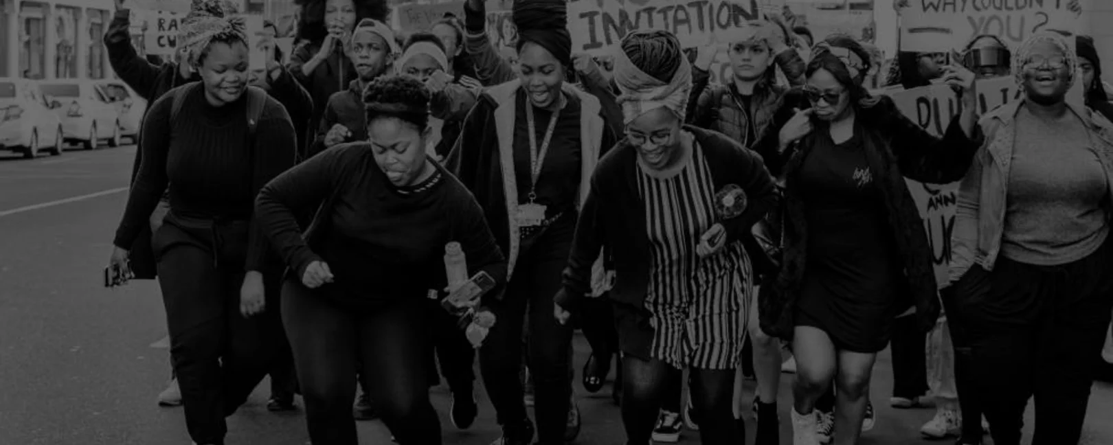 Women with banners demonstrating